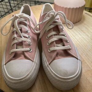 Pink and white canvas shoes